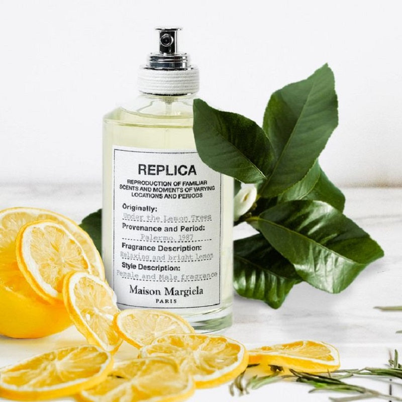 Maison Margiela Under the Lemon Trees Eau de Toilette inspired by sunlit citrus groves, Mediterranean breezes and peaceful summer afternoons.