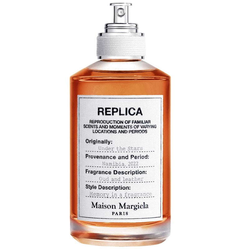 A bottle of Maison Margiela fragrance, specifically the 'Under the Stars' variant, with a spray nozzle, labeled with the product name and brand.