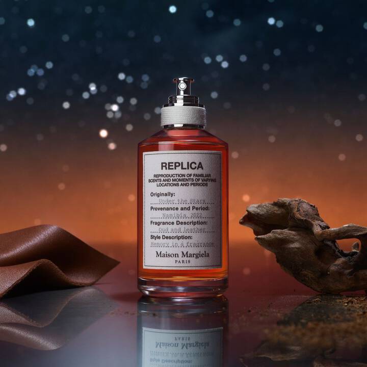 Replica perfume bottle with a starry night background