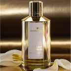 Mancera Instant Crush perfume bottle with gold cap on a dark background