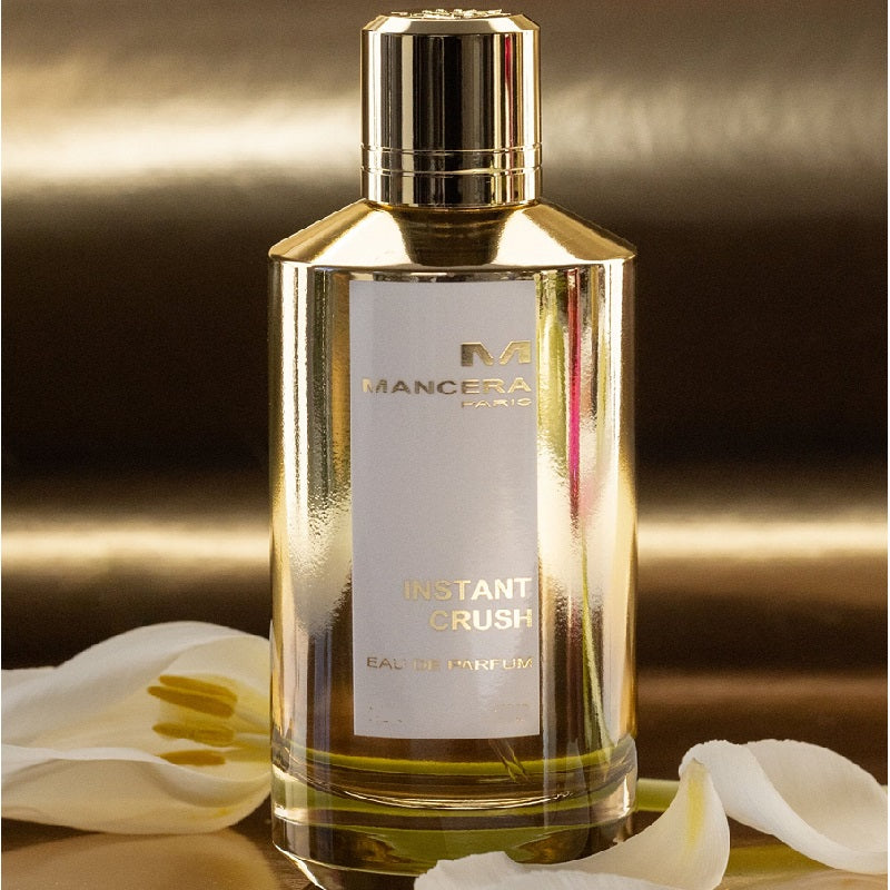 Mancera Instant Crush perfume bottle with gold cap on a dark background
