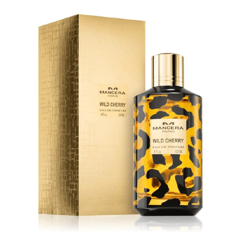 A bottle of Wild Cherry Eau De Parfum by Mancera with a leopard print design, alongside its golden packaging box.