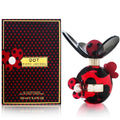 Packaging and bottle of Marc Jacobs Dot perfume, with a red and black design and a ladybug motif.
