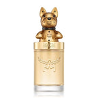 MCM Gold perfume bottle with a metallic gold dog-shaped cap and clear glass base on a white background.