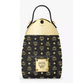 MCM black and gold handbag with a top handle, featuring the brand's signature monogram pattern and a gold-tone metal plaque on the front pocket.