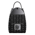 MCM mini backpack in black coated canvas with the signature monogram pattern, featuring a silver-tone metal top panel, black leather handle, and a silver-tone front metal plate with the MCM logo.