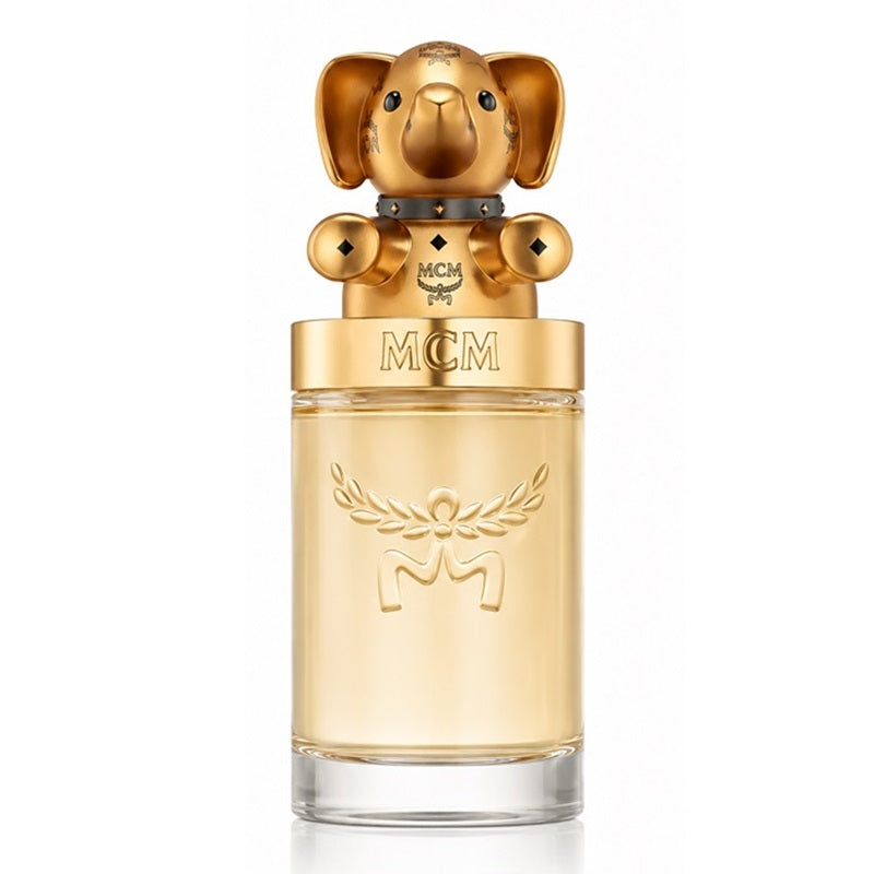 MCM 2015 Eau de Parfum bottle with a gold elephant-shaped cap and a gold-toned glass body, shown on a white background.