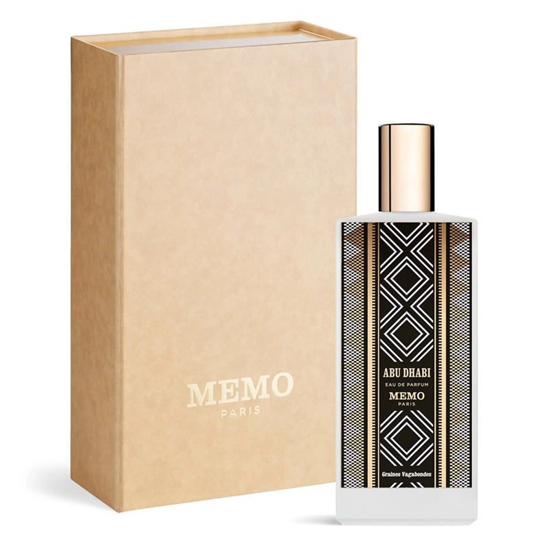 Memo Paris Abu Dhabi 75ml Eau de Parfum decorated bottle beside its plain kraft presentation box with gold Memo Paris branding on white