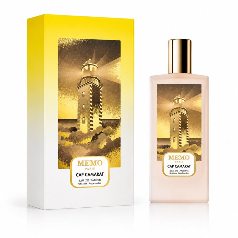 A perfume bottle and its matching box from MEMO PARIS, Cap Camarat, featuring a golden-yellow lighthouse illustration on a white and yellow gradient background.