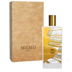 Memo Paris perfume bottle with gold cap and packaging on a white background