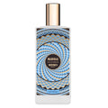 Madurai Eau de Parfum bottle by Memo Paris, featuring a square white glass bottle with a metallic gold cap and a black label decorated with a blue and gold geometric spiral pattern.
