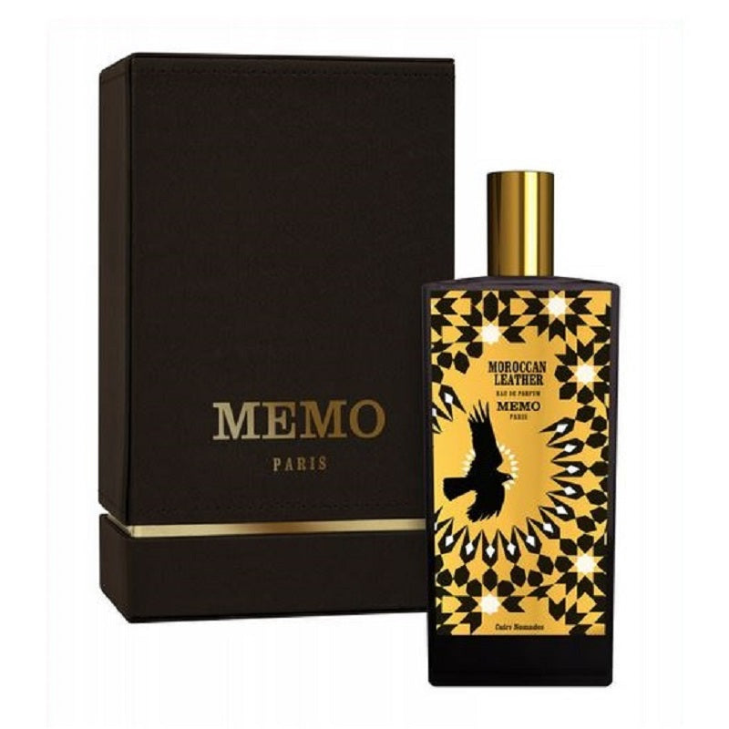 Memo Paris perfume bottle with black and gold design and matching box on a white background