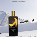 Perfume bottle with mountain and reindeer scene in the background