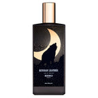Perfume bottle with wolf design and 'Memo Paris' branding on a white background