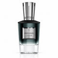A bottle of J'ADQUIRE MIND GAMES Pomegranate London fragrance, featuring a dark green-to-clear gradient glass bottle with a polished silver cap and a silver label.
