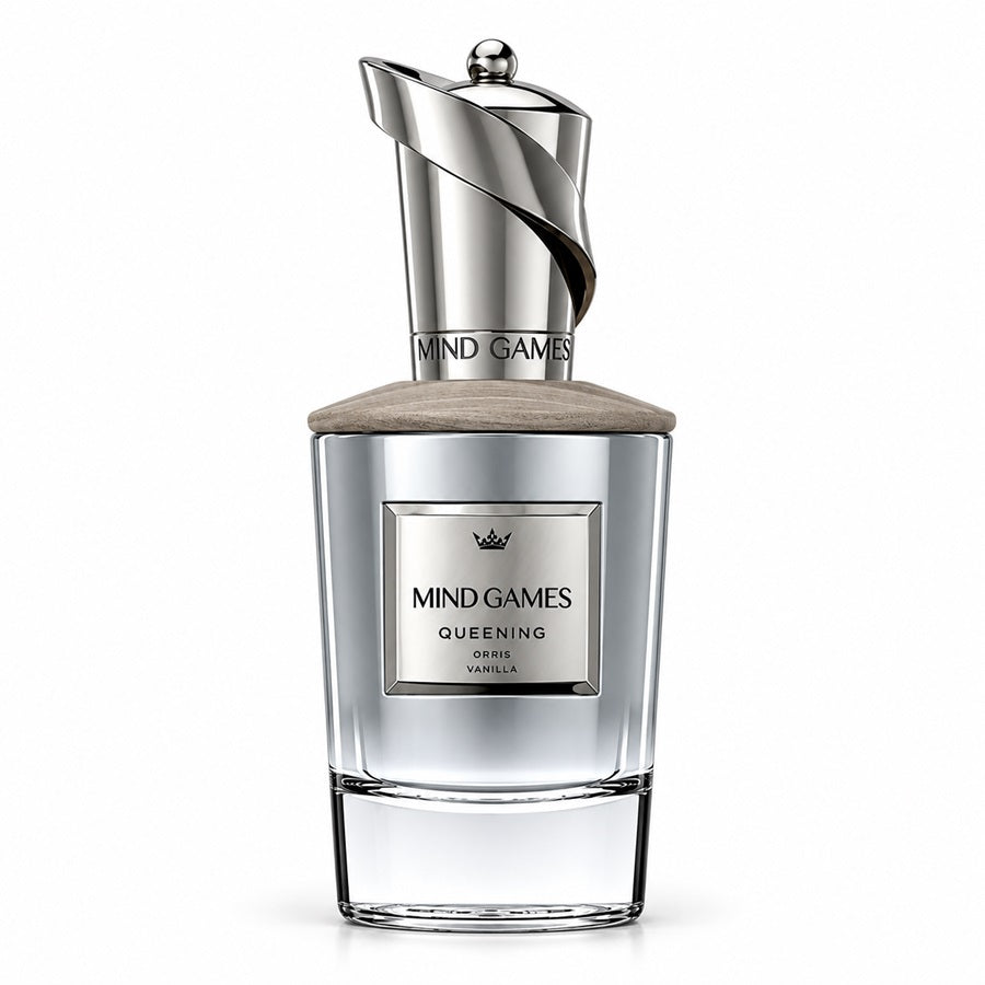 Mind Games Queening perfume bottle with a silver metallic cap, clear glass body, and a light beige textured lid, shown on a white background.
