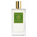 A clear rectangular glass perfume bottle with a gold cap and a green front label reading Mizensbir Anticonformiste, shown on a plain white background.