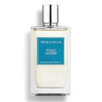 A square-shaped glass bottle of Mizensir Tonic Water Eau de Parfum with a blue label and a silver cap.