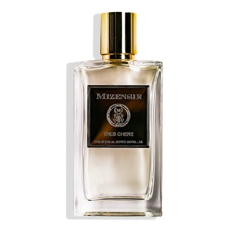A glass bottle of Mizensir Tres Chere Eau de Parfum with a black label and a gold-colored cap.