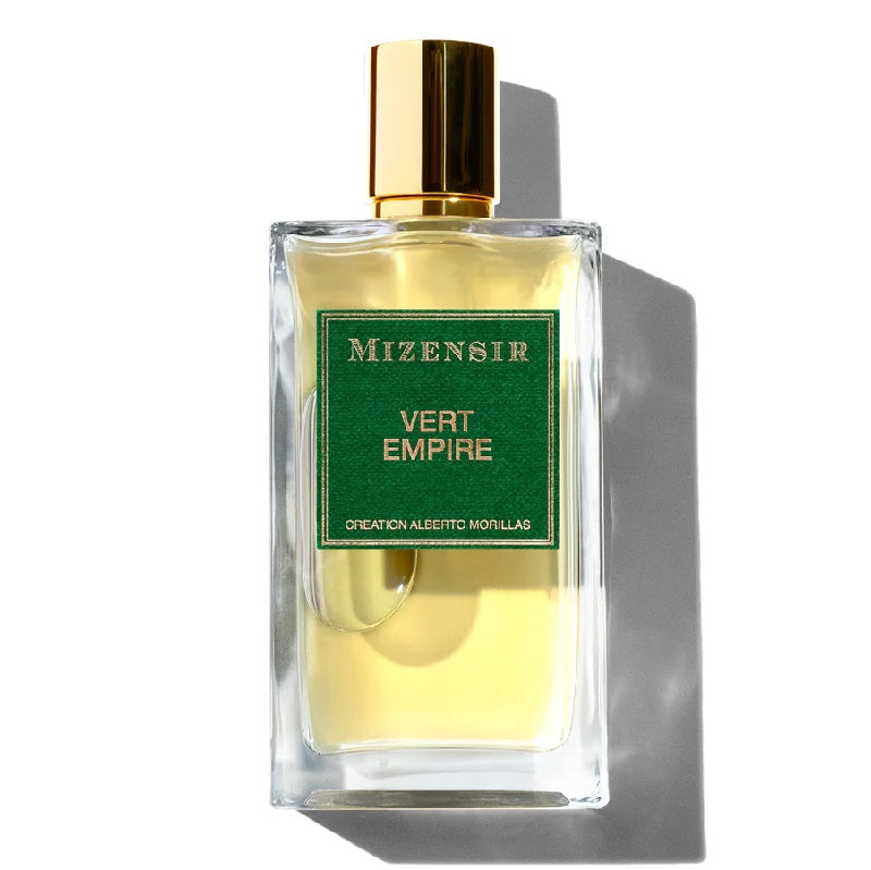 A glass bottle of Mizensir Vert Empire eau de parfum with a green label and a gold-colored cap.