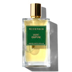 A glass bottle of Mizensir Vert Empire eau de parfum with a green label and a gold-colored cap.
