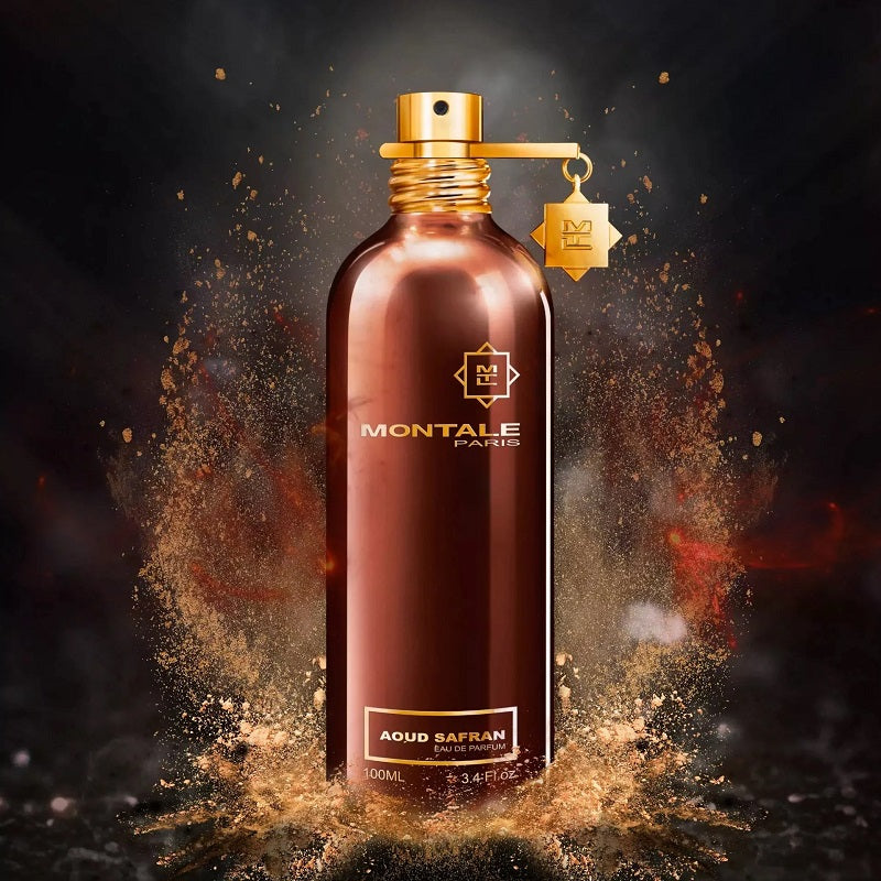 Montale Paris perfume bottle with gold spray nozzle on a dark background