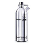 A silver bottle of Montale Chocolate Greedy Eau de Parfum with a black label and a decorative element on the cap.