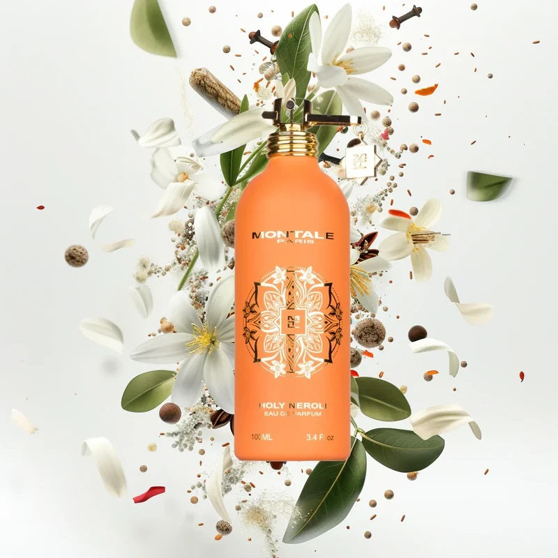 Montale Paris perfume bottle surrounded by flowers and leaves on a light background