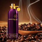 Montale Paris Intense Cafe Eau de Parfum bottle in metallic purple with gold accents, surrounded by roasted coffee beans and a wooden bowl with rising steam.