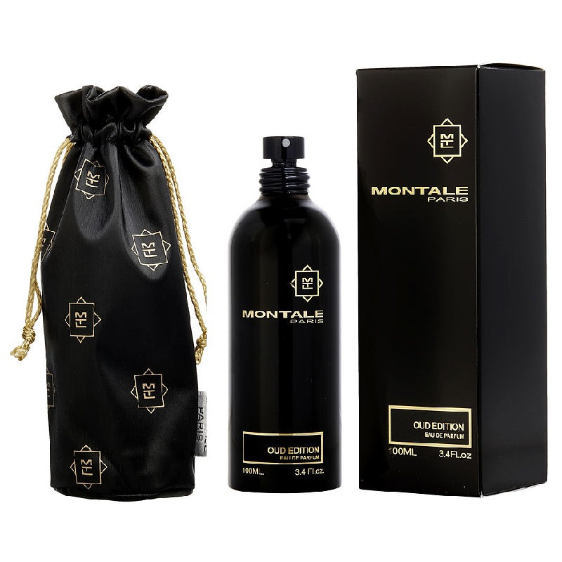 A black bottle of Montale Oud Edition Eau De Parfum with a spray dispenser, next to its black box adorned with white Montale branding and a gold design. A black fabric pouch with gold details is also displayed.