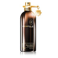 A brown bottle of Montale Wild Aoud Eau de Parfum with a gold spray nozzle and a small gold keychain attached to it.