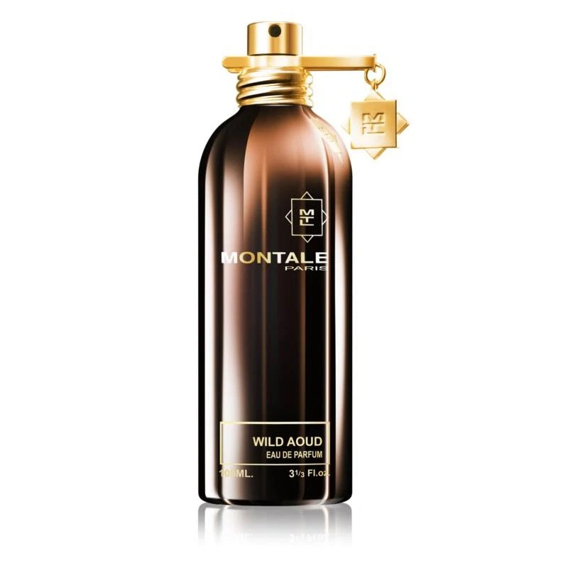 A brown bottle of Montale Wild Aoud Eau de Parfum with a gold spray nozzle and a small gold keychain attached to it.