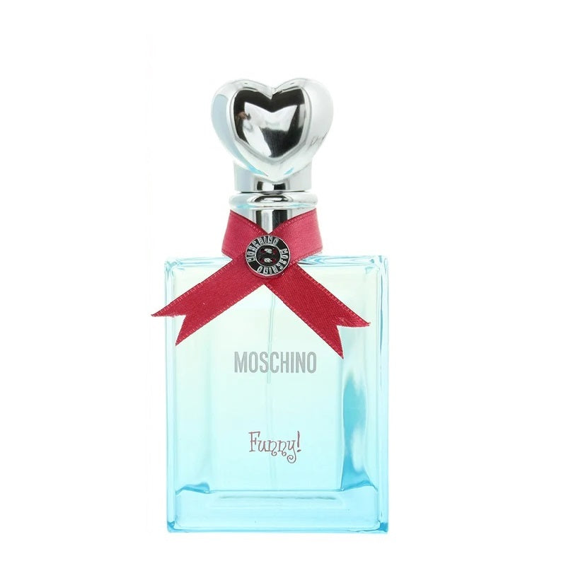 A bottle of Moschino Funny Eau de Toilette with a clear glass container, blue liquid, and a decorative red ribbon with a heart-shaped stopper.