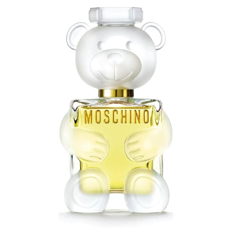 A bottle of Toy 2 Eau de Parfum by Moschino, featuring a clear teddy bear-shaped container with yellow perfume inside.