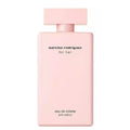 A pink bottle of Narciso Rodriguez for Her Eau de Toilette with a simple, elegant design.