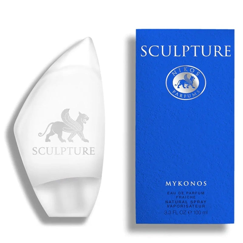A white sculptural perfume bottle shown next to its blue packaging box. The bottle features a winged lion logo and the name 'SCULPTURE', while the box displays the brand 'Nikos Varevoulis' and the product name 'MYKONOS'.