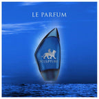 A blue glass perfume bottle labeled 'SCULPTURE' with a white lion emblem, floating against a blue ocean and sky background with the text 'LE PARFUM' above.