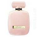 Pink Nina Ricci perfume bottle on a white background