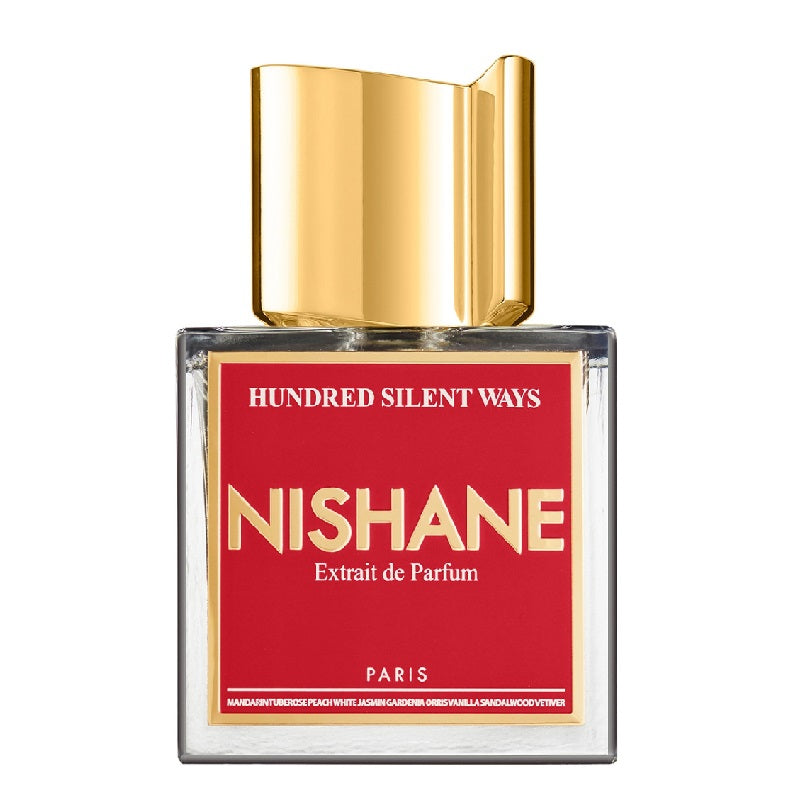 A bottle of Hundred Silent Ways Extrait de Parfum by Nishane with a red label and a gold-colored cap.