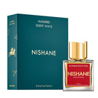A product image featuring a 50ml bottle of 'Hundred Silent Ways' extract de parfum by Nishane. The bottle has a gold cap and is displayed in front of a teal box with the Nishane brand logo and name.