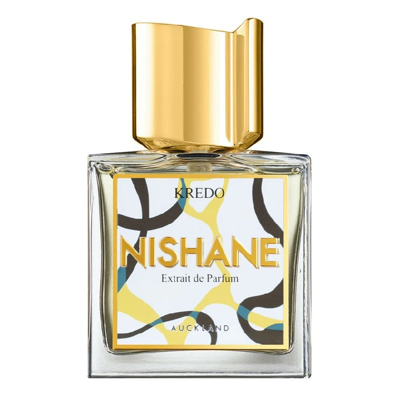 A square-shaped glass bottle of Kredo Extrait de Parfum by Nishane with a gold-colored cap and a label featuring geometric patterns in yellow, black, and white.