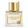 A square glass bottle of Nishane Extrait de Parfum by Petra, featuring a reflective gold cap, golden-yellow liquid, and a cream label with gold and black text and a red rose logo.