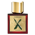 A square-shaped perfume bottle with a clear glass body and a gold-colored cap. The label reads 'TUBEROZA X NISHANE Extrait de Parfum WARSZAWA'.