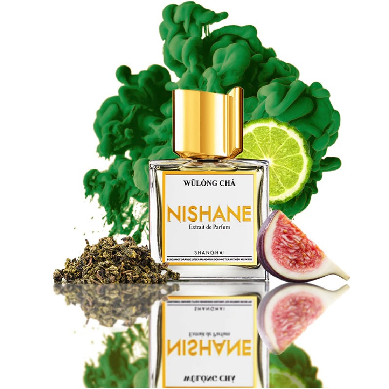 Nishane perfume bottle with green leaves, lime, and figs on a white background