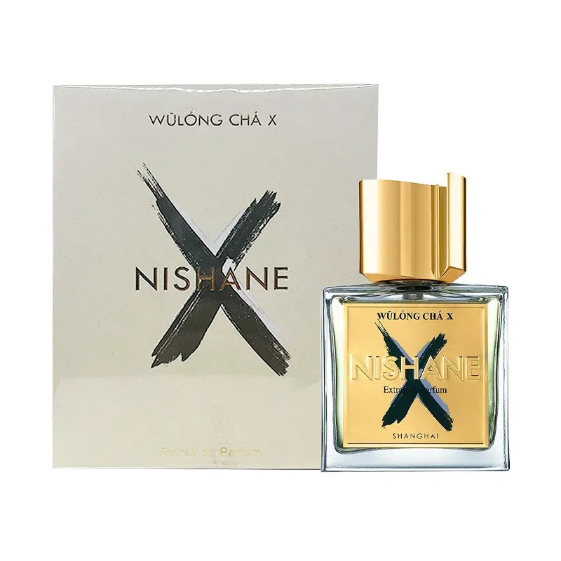 A bottle of Nishane Wülöng Chá X perfume with a distinctive black and gold design, accompanied by its packaging.