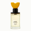 A bottle of Ormaie Papier Carbone eau de parfum with a yellow cap and a label that reads 'PAPIER CARBONE'.