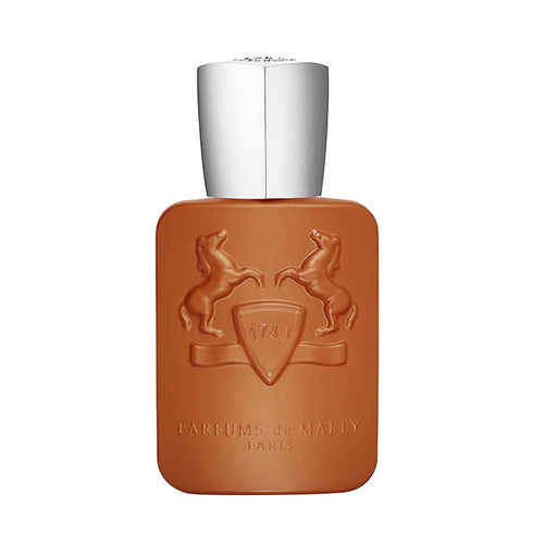 A bottle of Althaír Eau de Parfum by Parfums De Marly with a brown tinted glass and a silver cap, featuring an embossed design of a horse and a shield.
