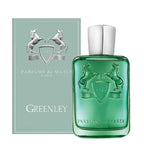 Parfums de Marly Greenley perfume bottle in translucent green glass with a silver cap, shown next to its matching sage green box featuring a silver horse emblem.