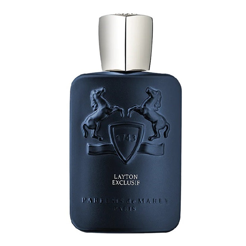 A dark navy blue rectangular perfume bottle with a metallic silver cap, featuring an embossed crest with two rearing horses and the text 'LAYTON EXCLUSIF' and 'PARFUMS DE MARLY PARIS'.