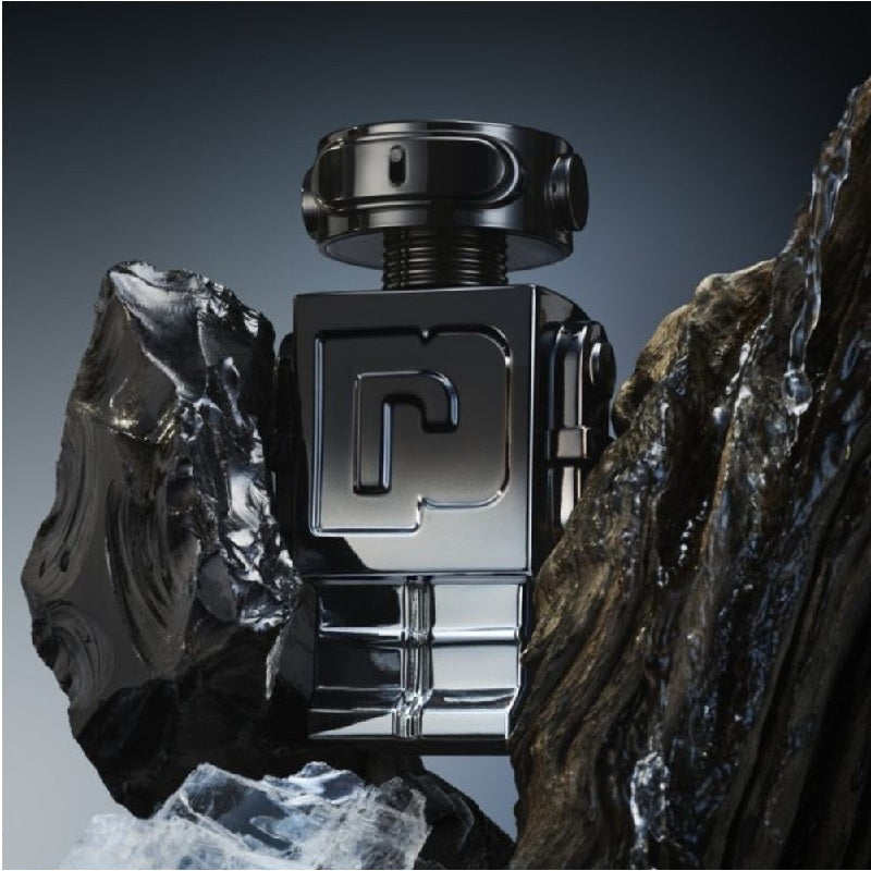 Black and silver perfume bottle with a geometric design on a dark background